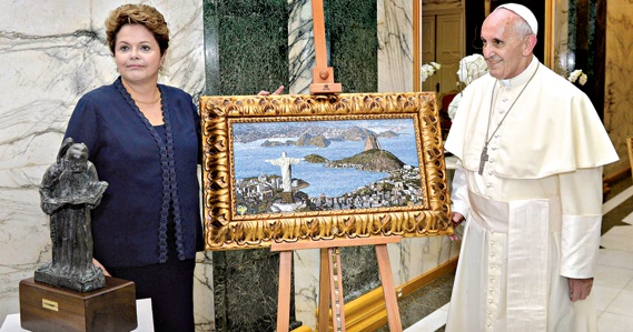 A presidente brasileira ofereceu um quadro ao papa, enquanto nas ruas junto ao palácio do governador eclodiam protestos e confrontos